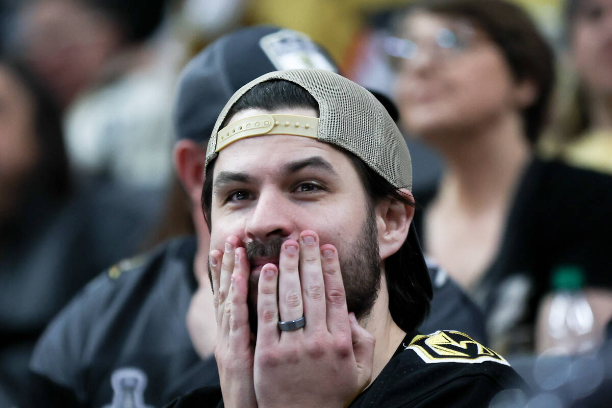 A Golden Knights fan reacts after the Ducks scored during the third period of an NHL hockey gam ...