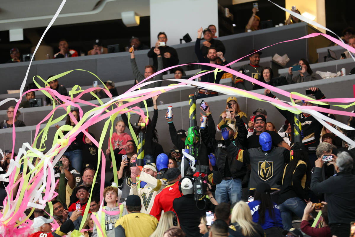 The Blue Man Group pumps up the crowd during the third period of an NHL hockey game between the ...