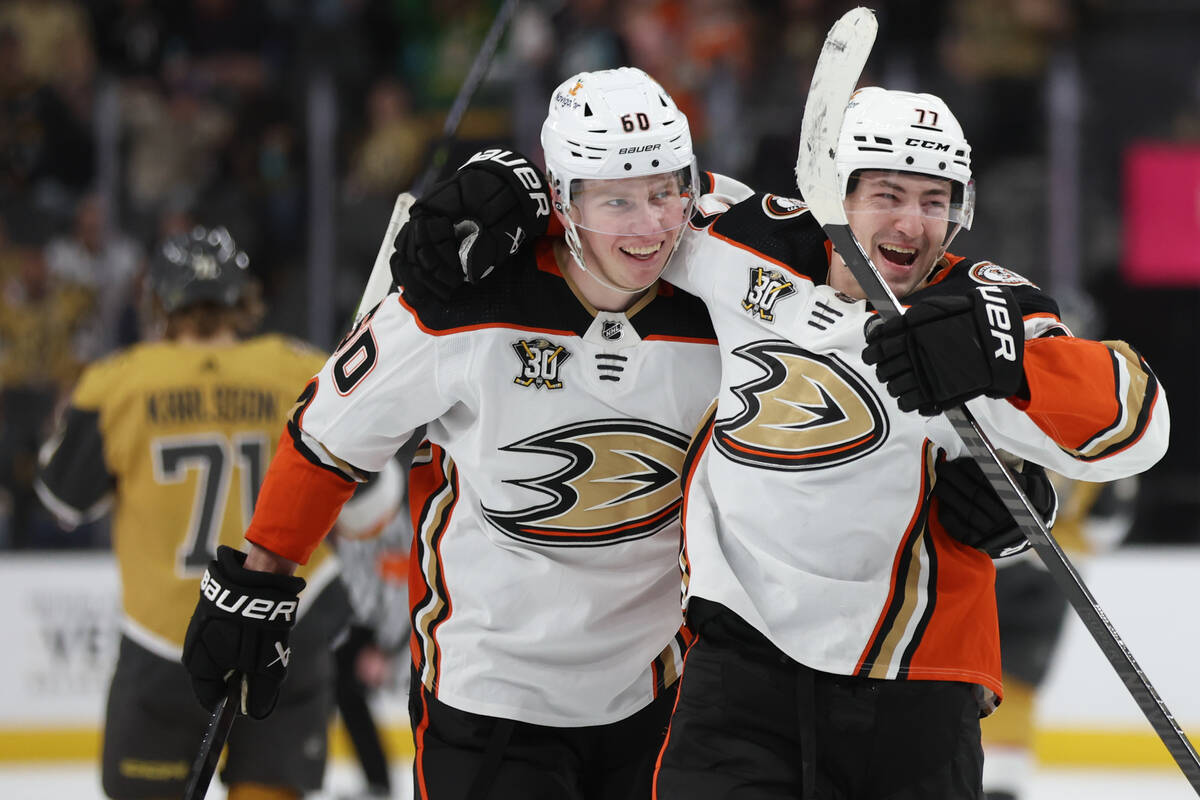 Ducks defenseman Jackson LaCombe (60) and Ducks right wing Frank Vatrano (77) celebrate as they ...