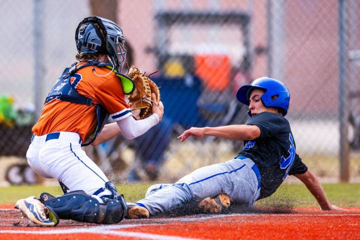 Sierra Vista batter Owen Angelo (30) slides home safely after a late throw to Legacy catcher Za ...