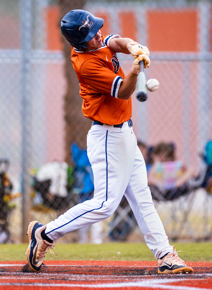 Legacy batter Kyler Avila (2) connects on a throw from a Sierra Vista pitcher during the second ...