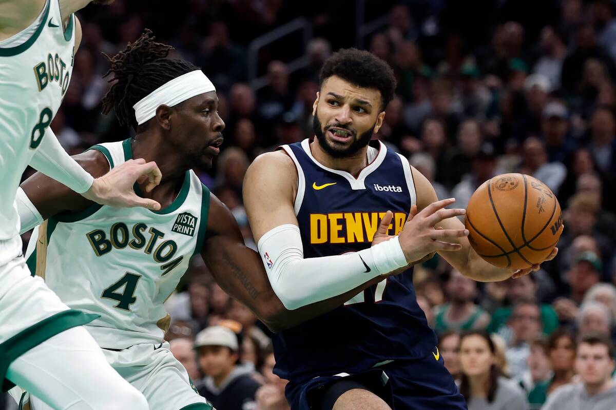 Denver Nuggets' Jamal Murray (27) drives past Boston Celtics' Jrue Holiday (4) during the secon ...