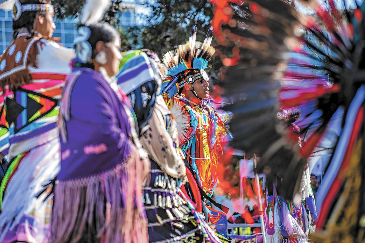 Dancers move about the grounds while performing for the crowd during the Powwow for the Planet ...