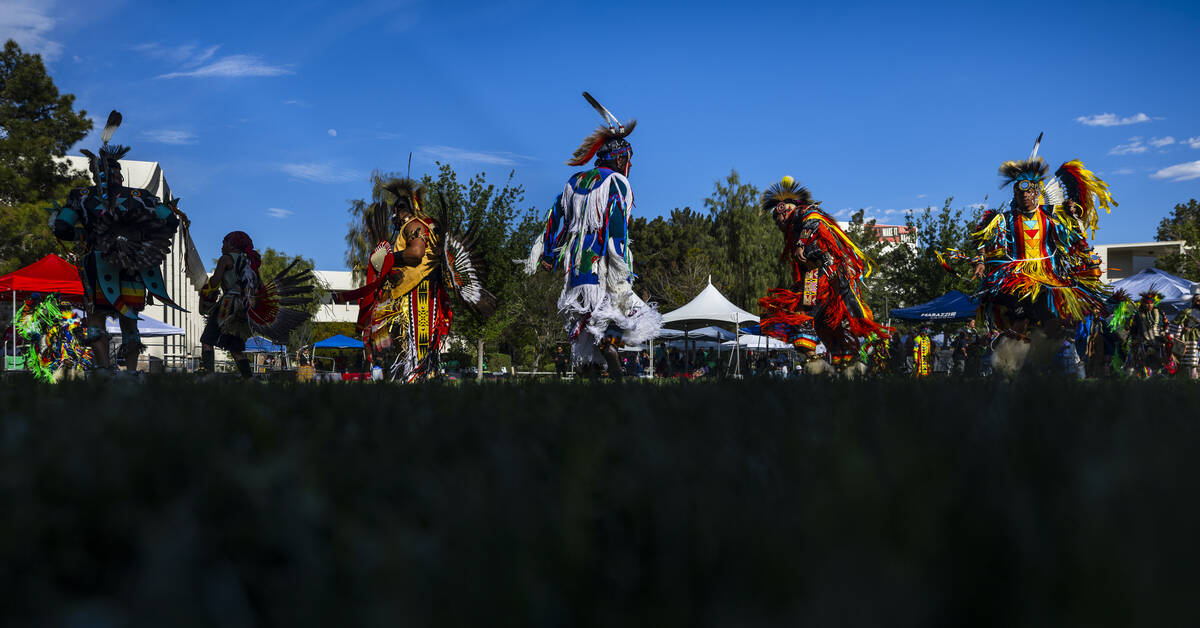 Dancers move about the grounds while performing for the crowd during the Powwow for the Planet ...