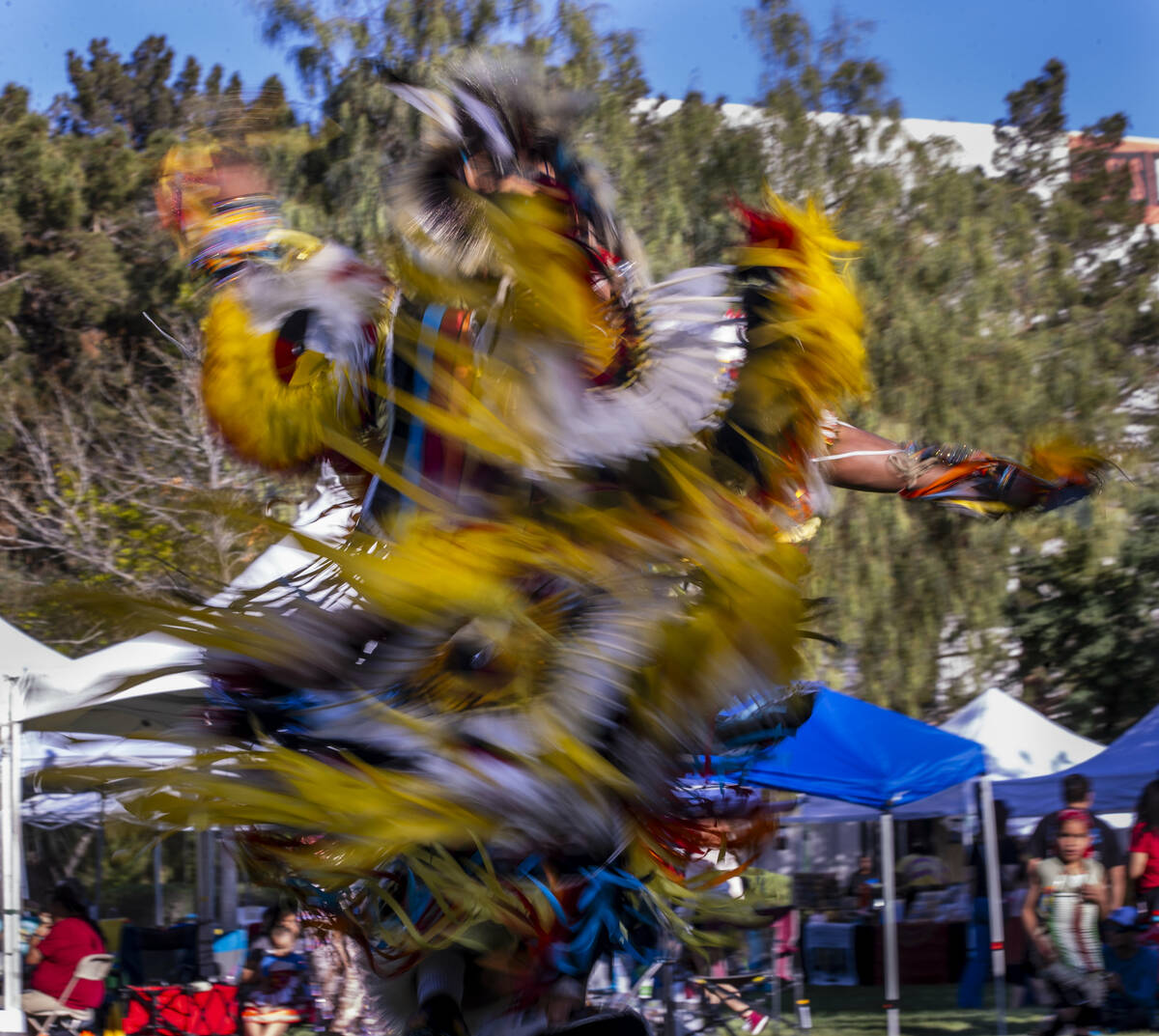 A dancer moves about the grounds while performing for the crowd during the Powwow for the Plane ...