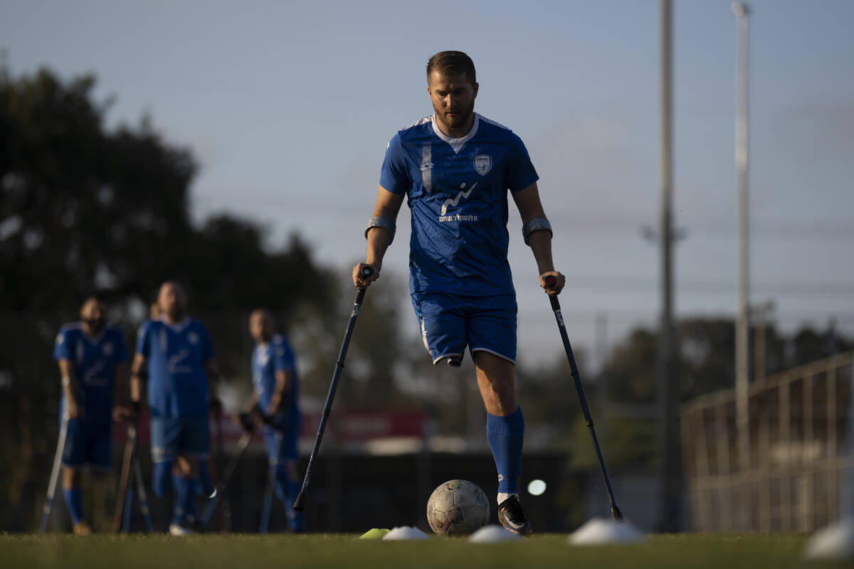 The soccer player of Israel Amputee Football Team, Ben Binyamin controls the ball during a prac ...