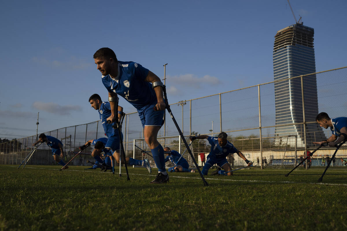 The soccer player of Israel Amputee Football Team, Ben Binyamin and his teammates prepare to ru ...