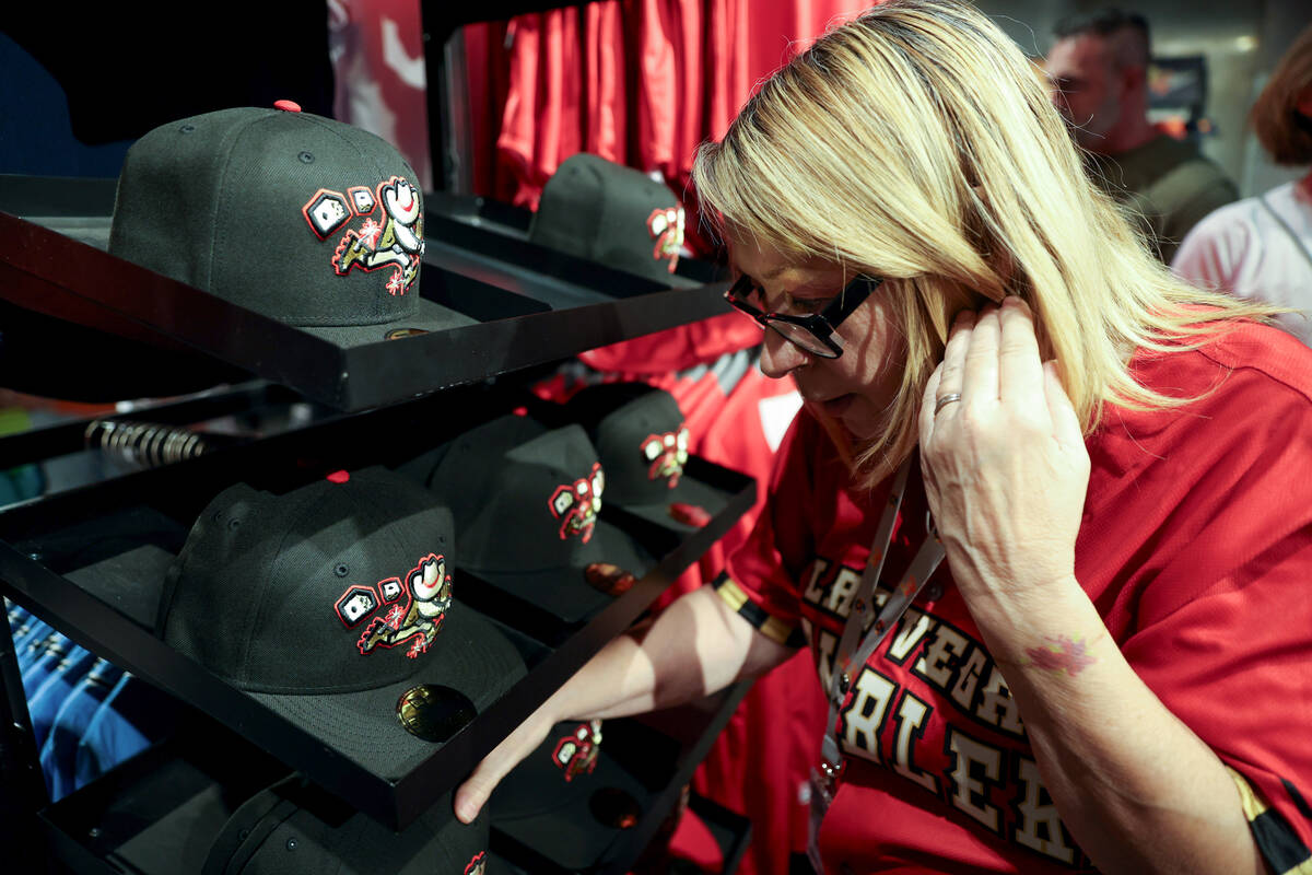 Fans check out Las Vegas Gamblers merchandise before a Minor League Baseball game against the T ...