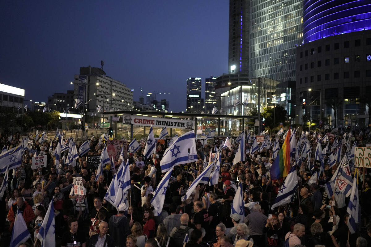 People protest against Israeli Prime Minister Benjamin Netanyahu's government and call for the ...