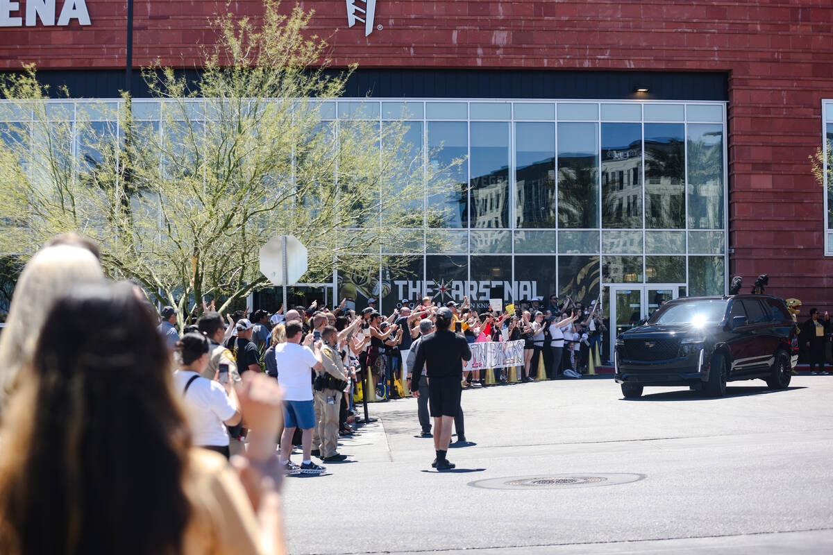 Fans cheer as Golden Knights players depart for Dallas for the start of the Stanley Cup playoff ...