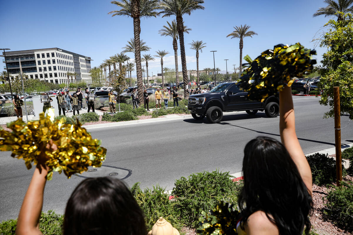 Fans cheer as Golden Knights players depart for Dallas for the start of the Stanley Cup playoff ...