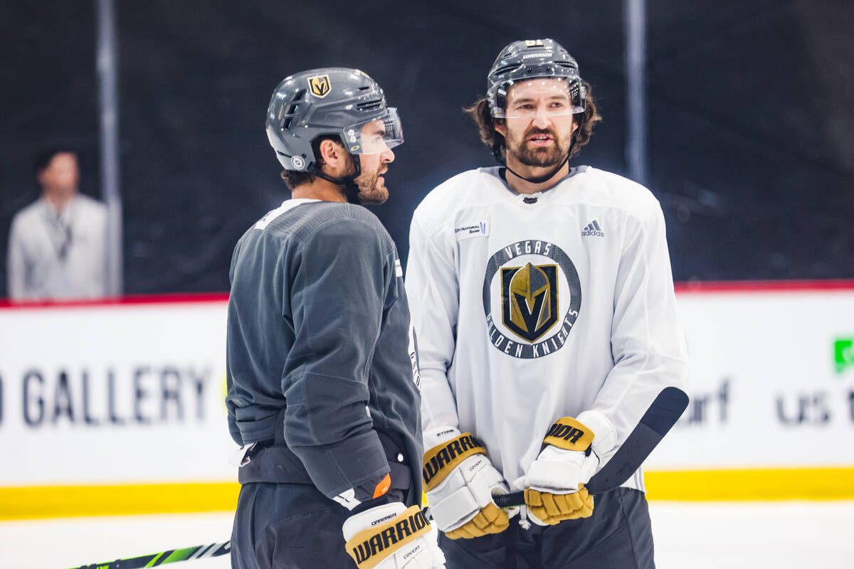Golden Knights right wing Mark Stone speaks with left wing William Carrier practice at National ...