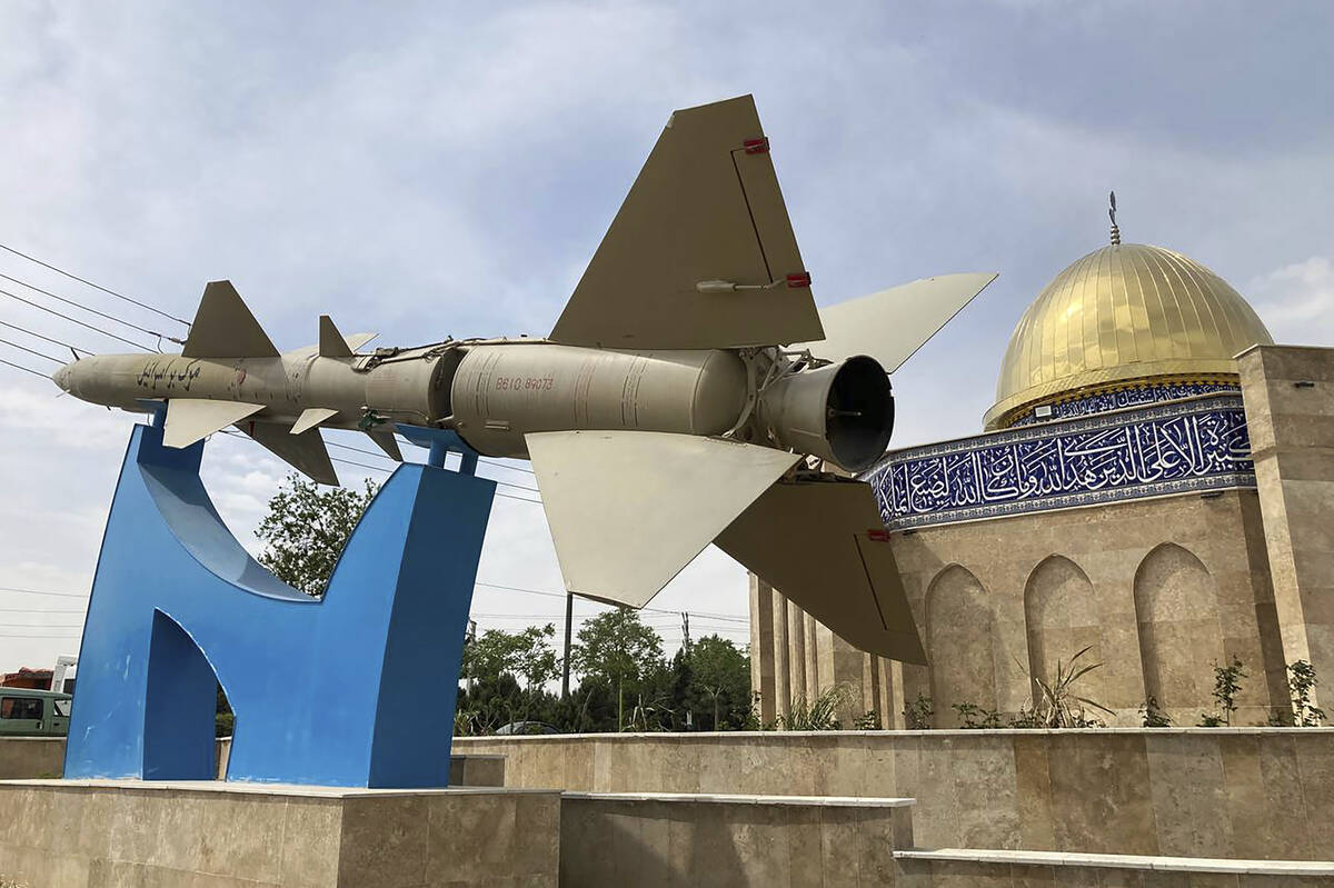A missile is on display with a sign on it reading in Farsi: "Death to Israel" in fron ...