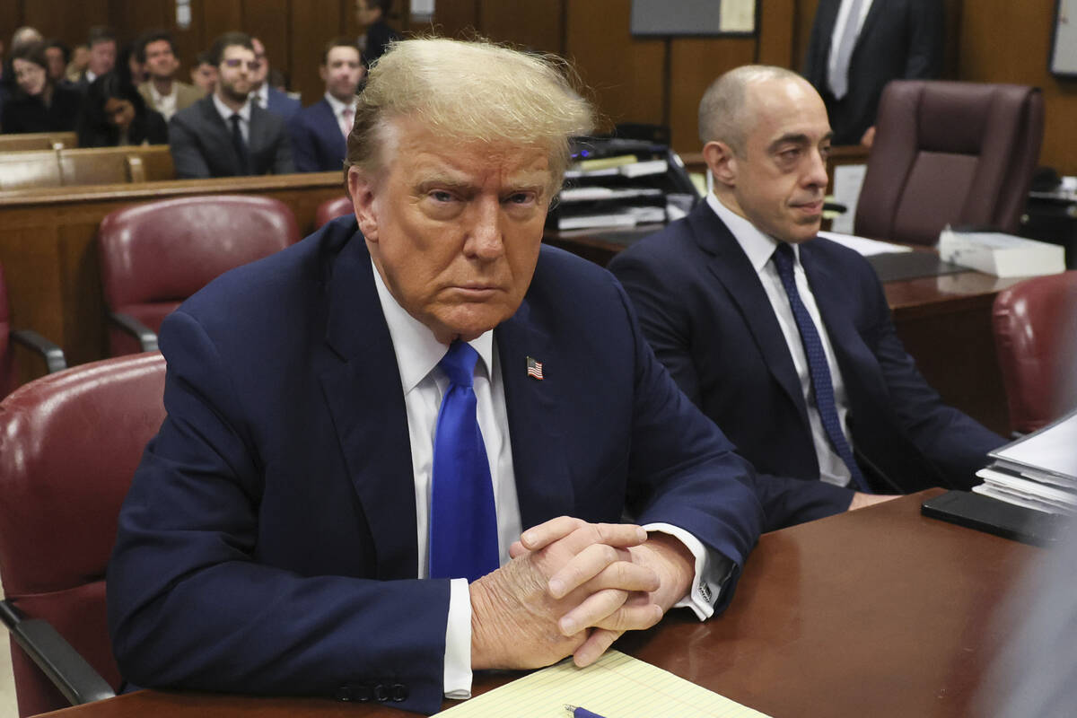 Republican presidential candidate and former President Donald Trump sits in the courtroom at hi ...