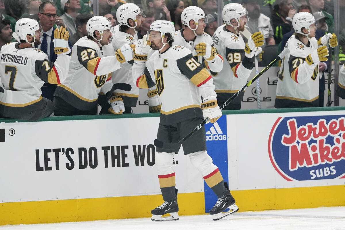 Vegas Golden Knights right wing Mark Stone (61) celebrates with the bench after scoring in the ...