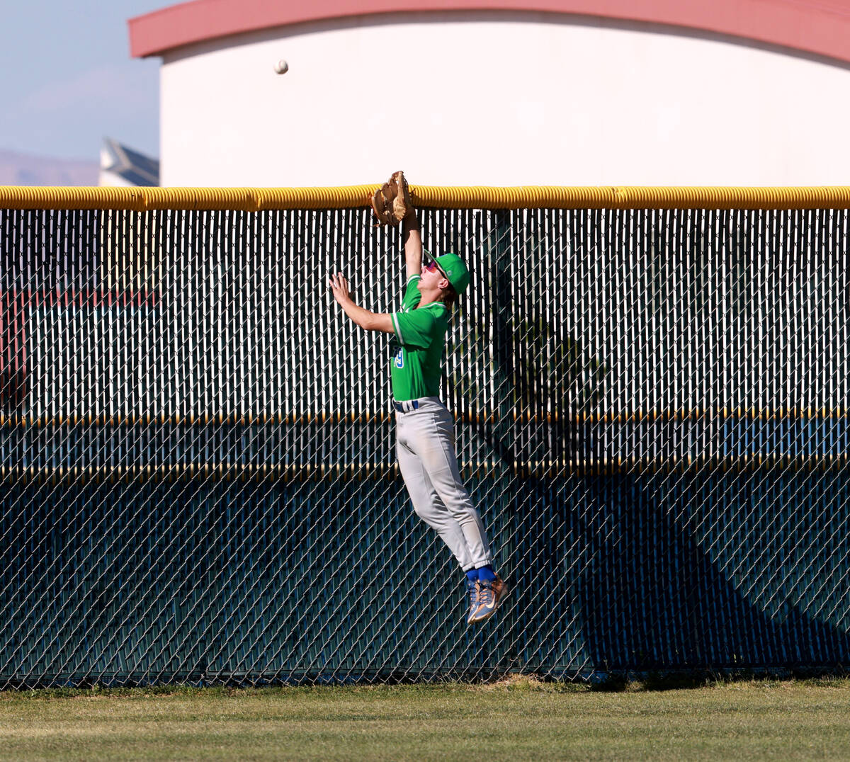 Green Valley outfielder Benjamin Byington (19) can’t reach a home run by Foothill’ ...