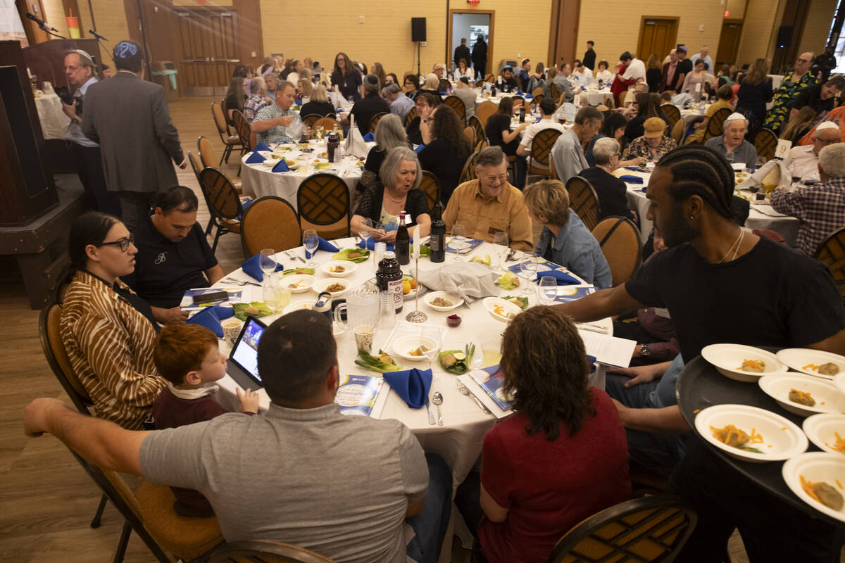 Matzah balls are passed out during a Passover Seder meal at Congregation Ner Tamid on Monday, A ...