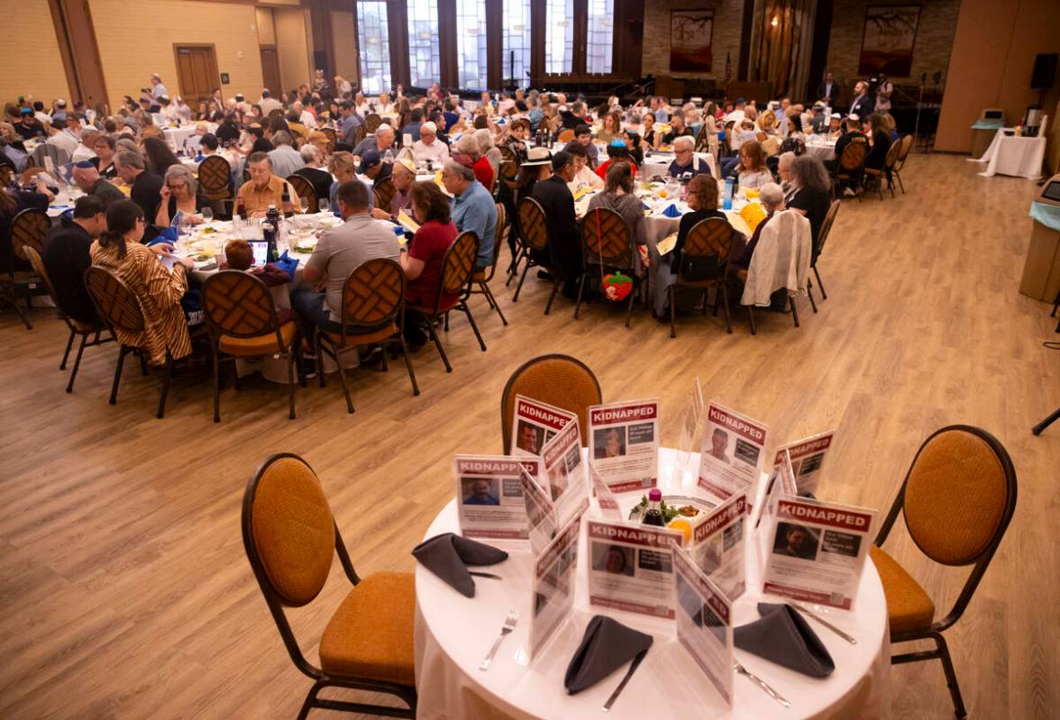 A table is set for hostages in held in Gaza during a Passover Seder meal at Congregation Ner Ta ...