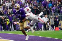 FILE - Washington wide receiver Rome Odunze (1) makes a catch for a touchdown against Utah corn ...