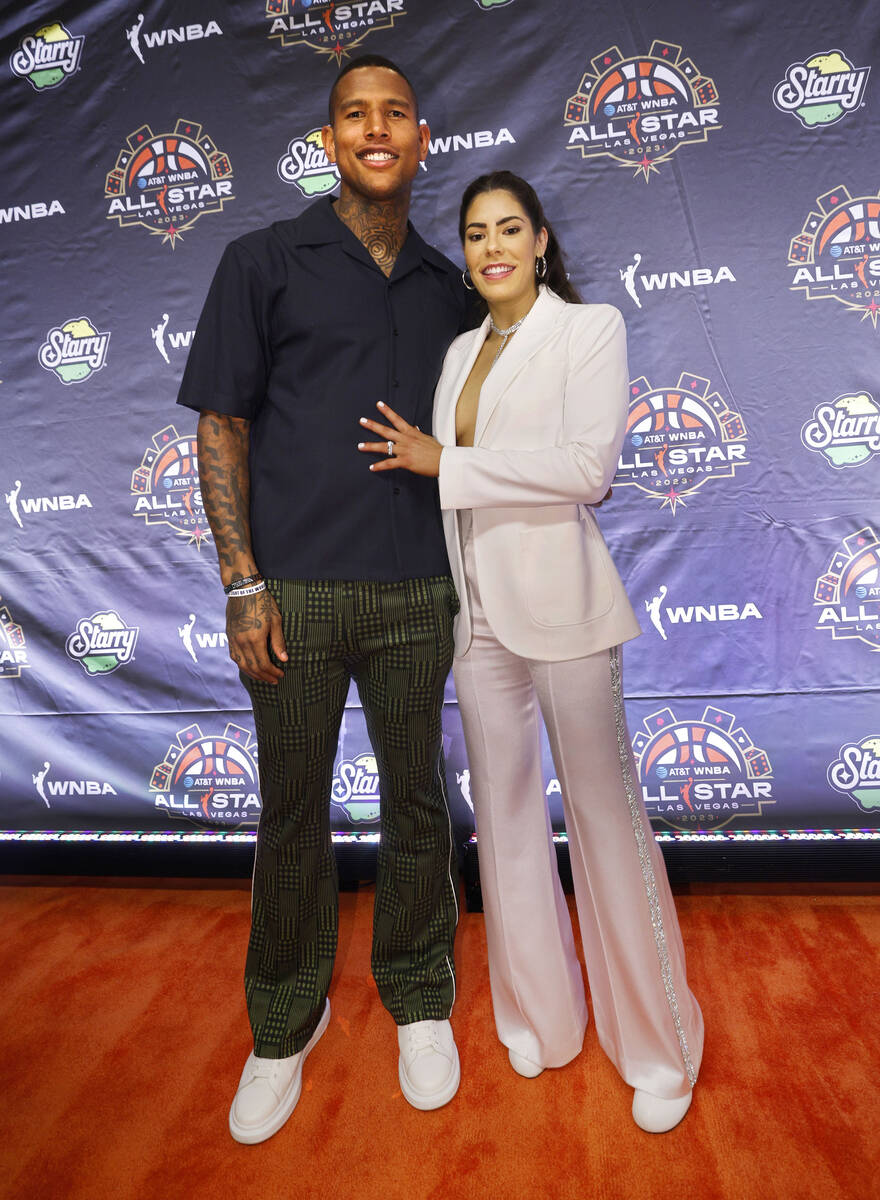 Kelsey Plum of Las Vegas Aces poses for a photo with New York Giants’ Darren Waller on the WN ...