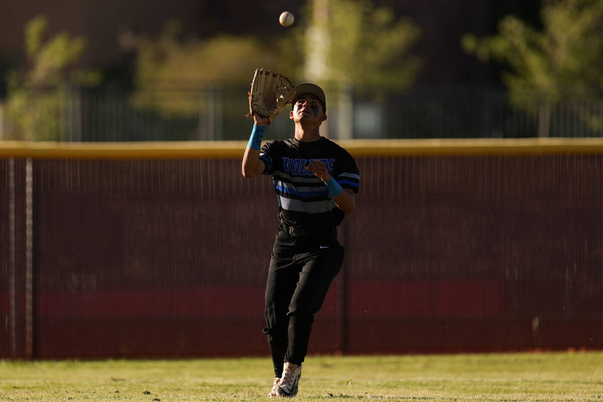 Basic outfielder Adrian Ramos (1) catches for an out on Faith Lutheran during a high school bas ...