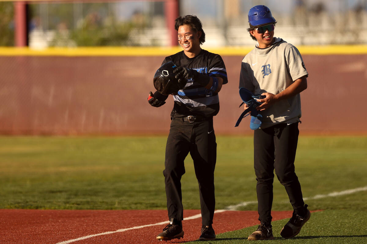 Basic outfielder Troy Southisene, left, and pitcher Tee Southisene, who is acting as first base ...