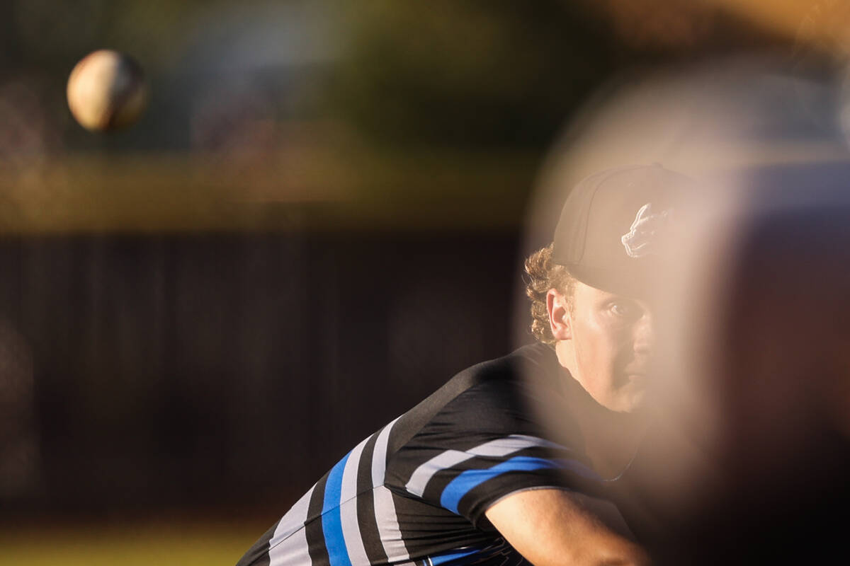 Basic pitcher Lincoln Evans (21) throws to Faith Lutheran during a high school baseball game on ...