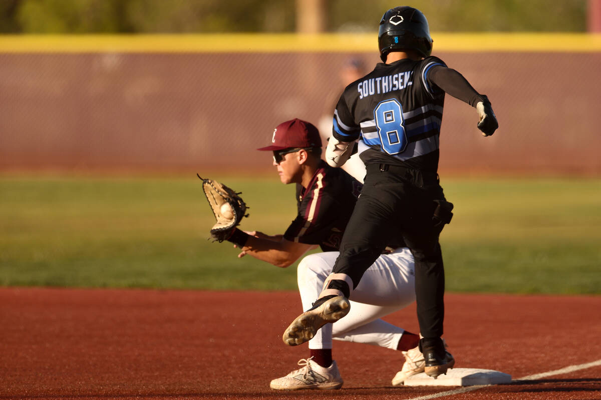 Basic second baseman Tate Southisene (8) can’t make it to first base while Faith Luthera ...