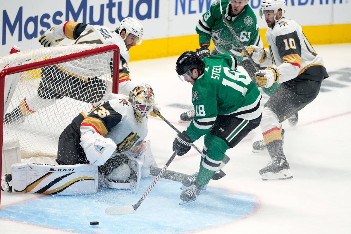 Vegas Golden Knights goaltender Logan Thompson (36) defends against pressure from Dallas Stars ...