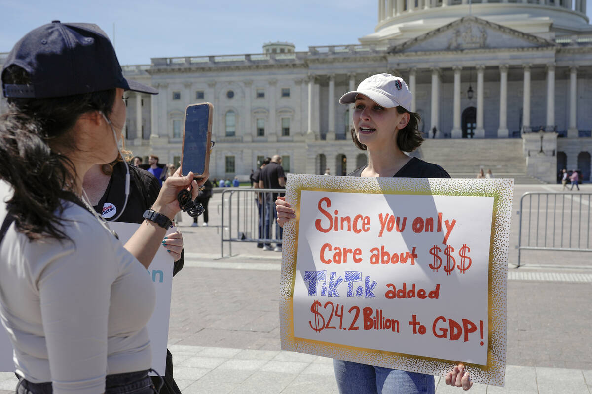 A TikTok content creator, speaks to reporters outside the U.S. Capitol, Tuesday, April 23, 2024 ...