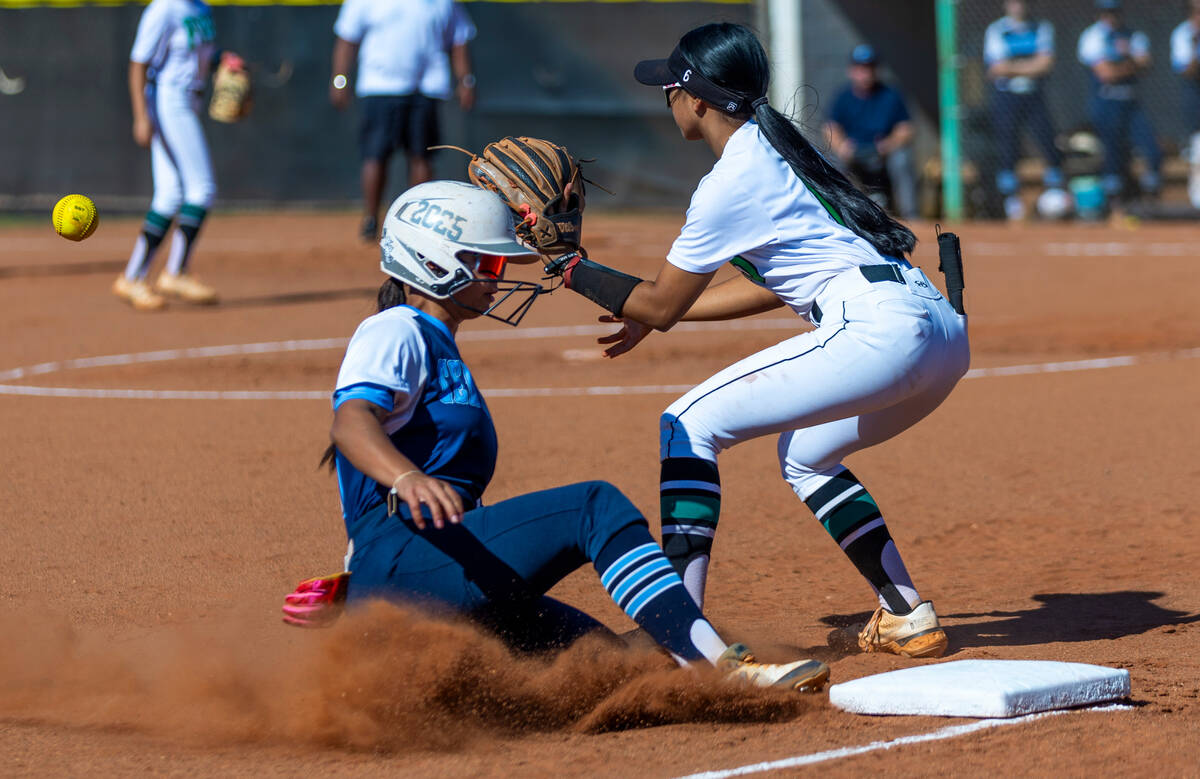 Centennial runner Amanda Campos-Colon (13) slides safely into third base ahead of a throw to Pa ...