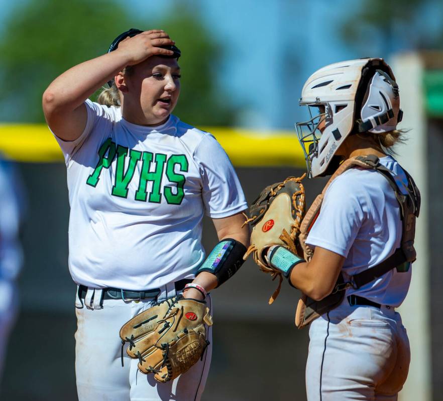 Palo Verde pitcher Bradi Odom (13) confers with catcher Madi Malloy while facing Centennial bat ...