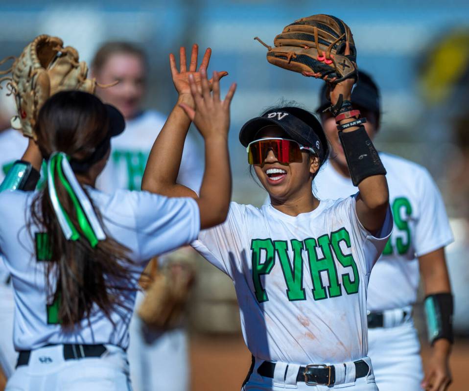 Palo Verde's Kayleen Enriquez (6) congratulates Alexis Kearnes (7) on a run-saving catch in the ...