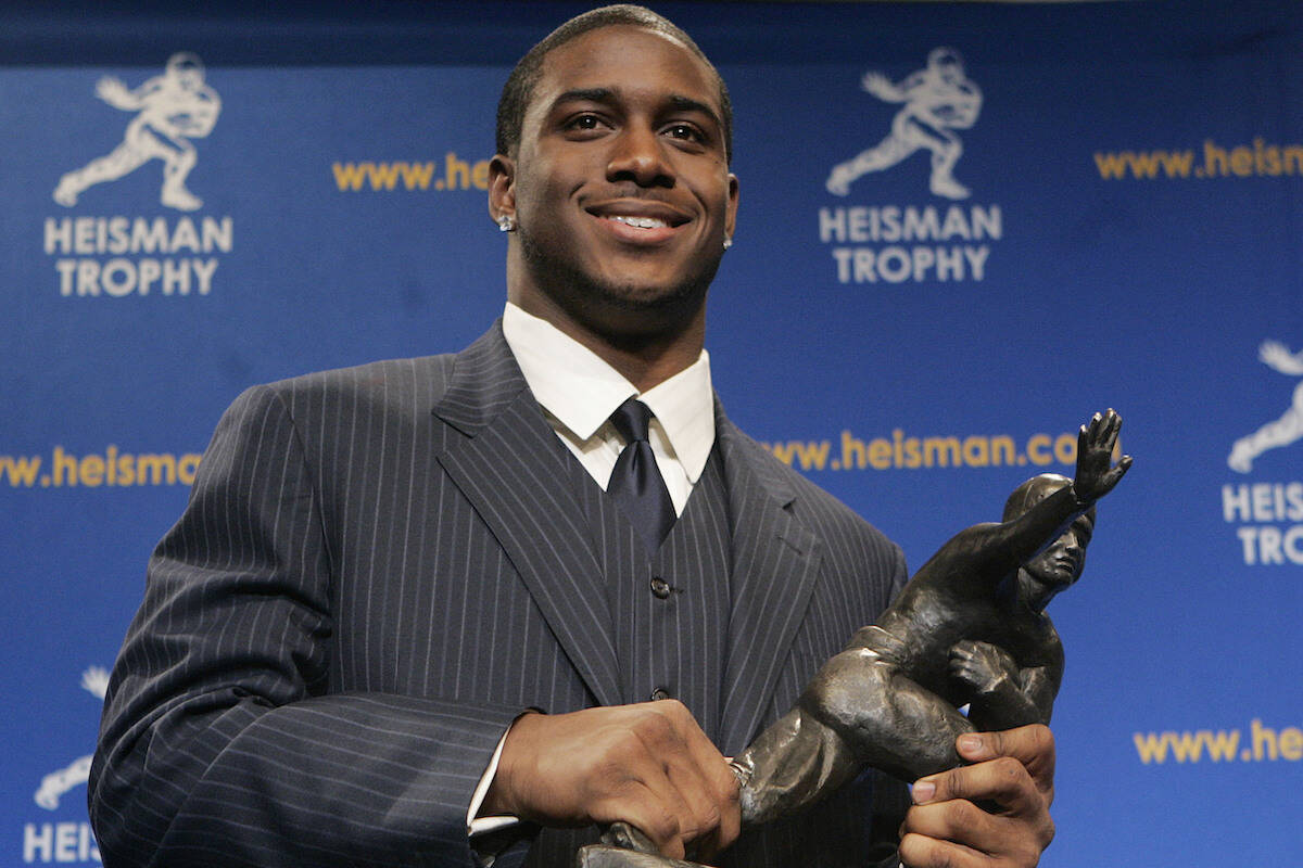 Heisman Trophy winner Reggie Bush of the University of Southern California smiles while posing ...