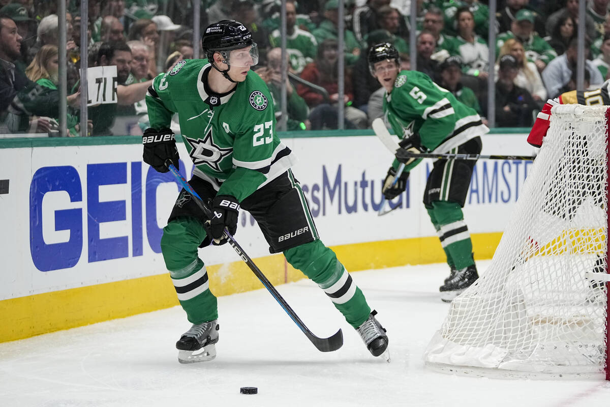 Dallas Stars defenseman Esa Lindell (23) controls the puck against the Vegas Golden Knights dur ...