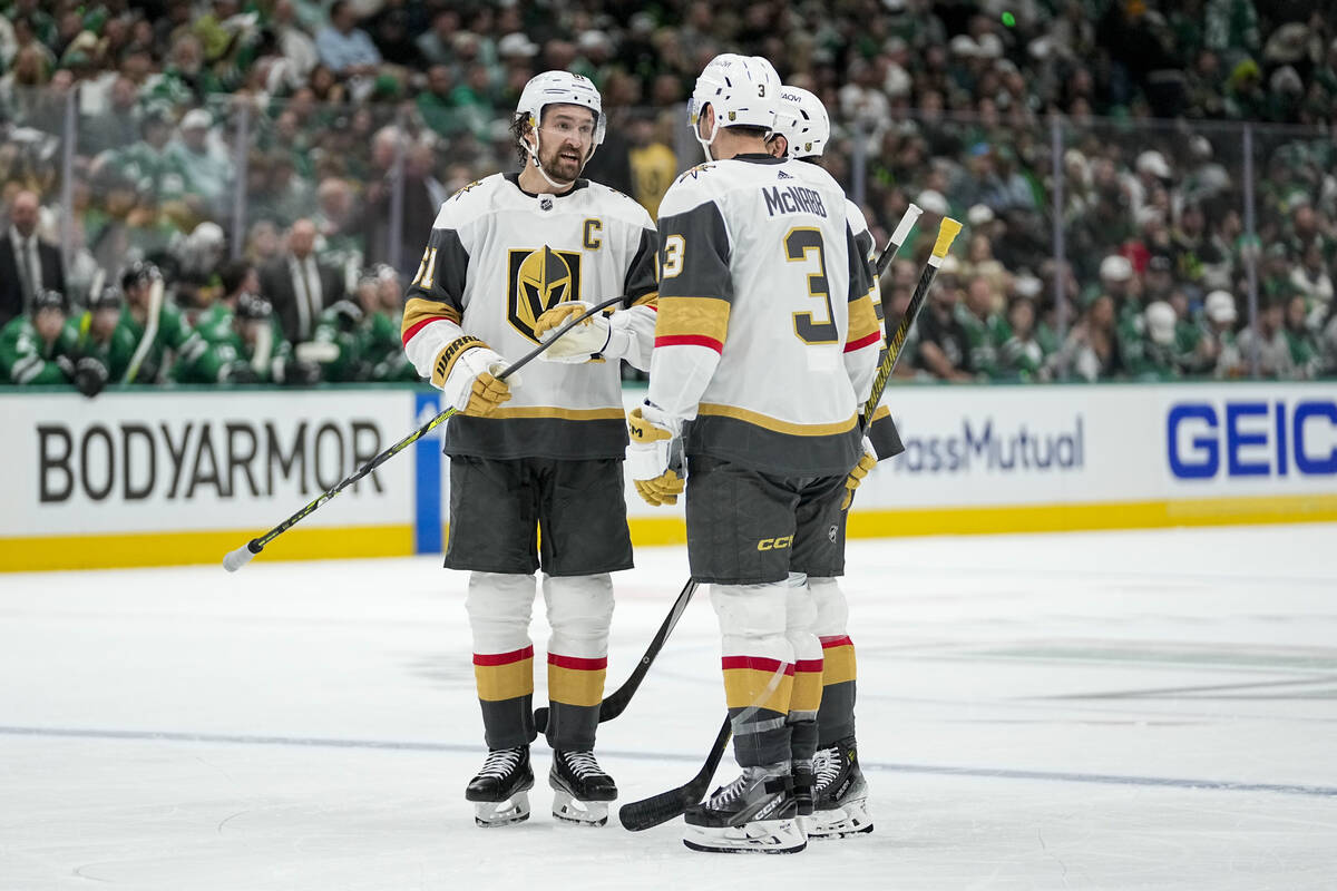 Vegas Golden Knights' Mark Stone (61), Shea Theodore (27) and Brayden McNabb (3) gather during ...