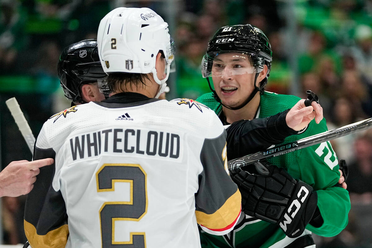 Vegas Golden Knights defenseman Zach Whitecloud (2) exchanges words with Dallas Stars left wing ...