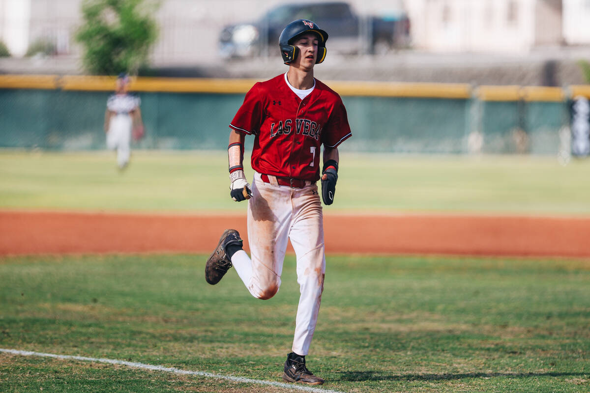 Las Vegas’ Mickey Martinez (7) runs to home base during a high school baseball game betw ...
