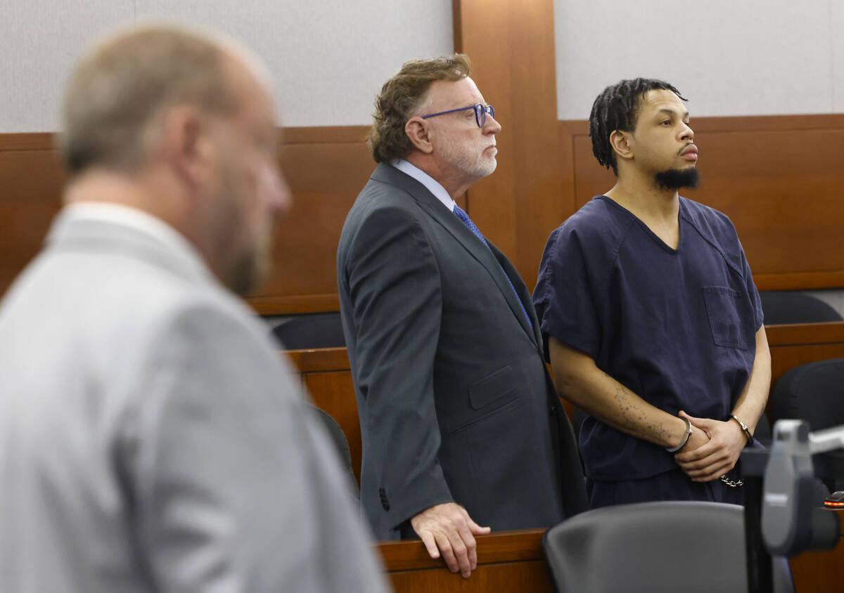 Terrell Rhodes, right, his attorney Robert Langford, center, and Chief Deputy District Attorney ...