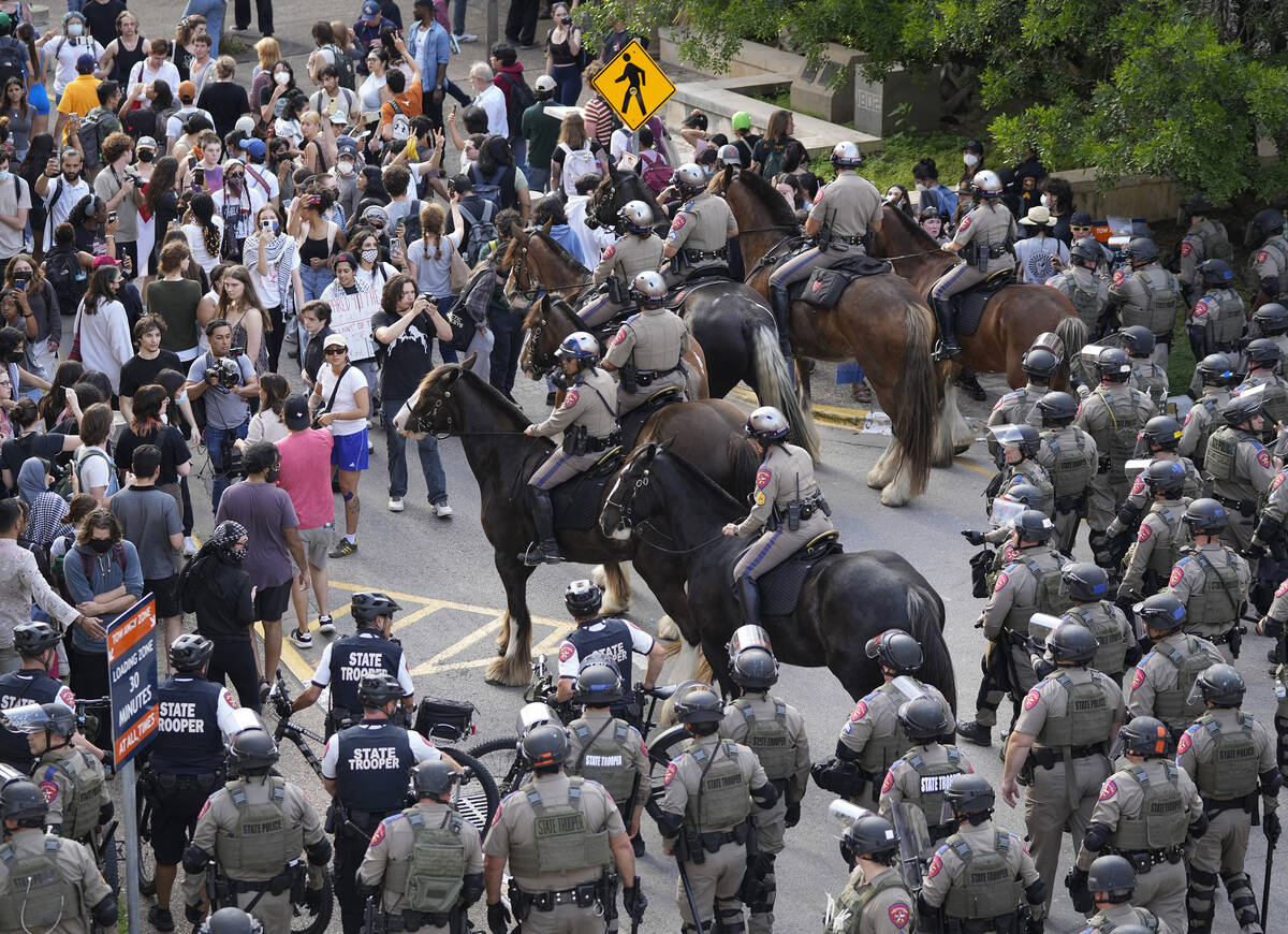 State troopers try to break up a pro-Palestinian protest at the University of Texas Wednesday A ...