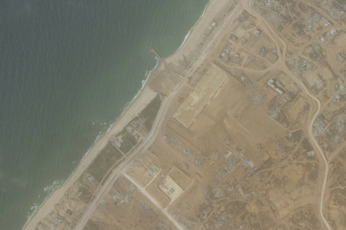 This satellite picture taken by Planet Labs PBC show the construction of a new aid port near Ga ...