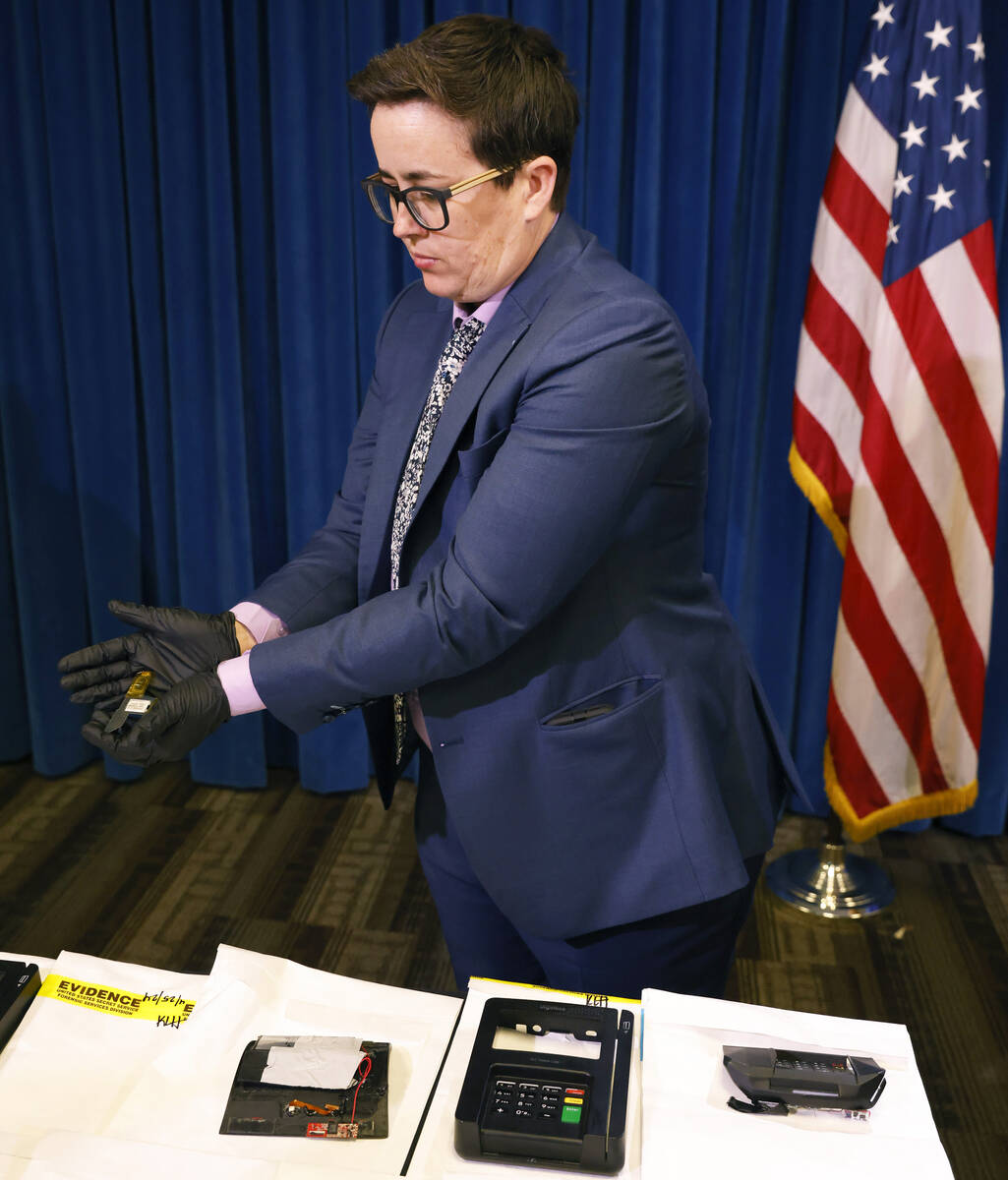 A secret service agent displays ATM and credit card skimming devices after a briefing on a oper ...