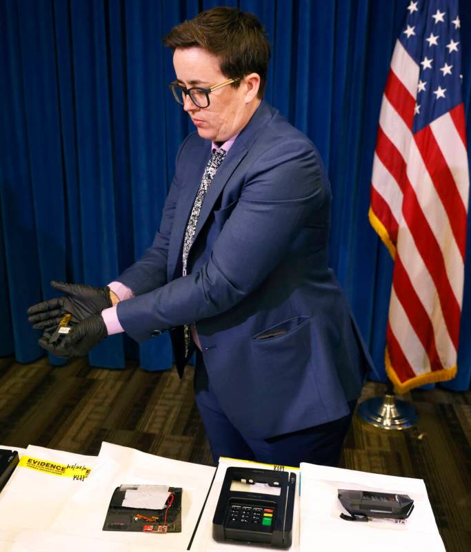 A secret service agent displays ATM and credit card skimming devices after a briefing on a oper ...
