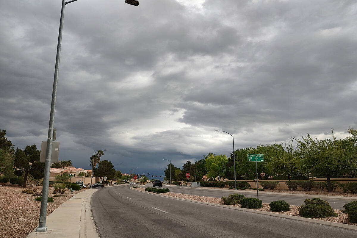 Storm clouds hover around Thomas W. Ryan and West Lake Mead boulevards on Friday, April 26, 202 ...