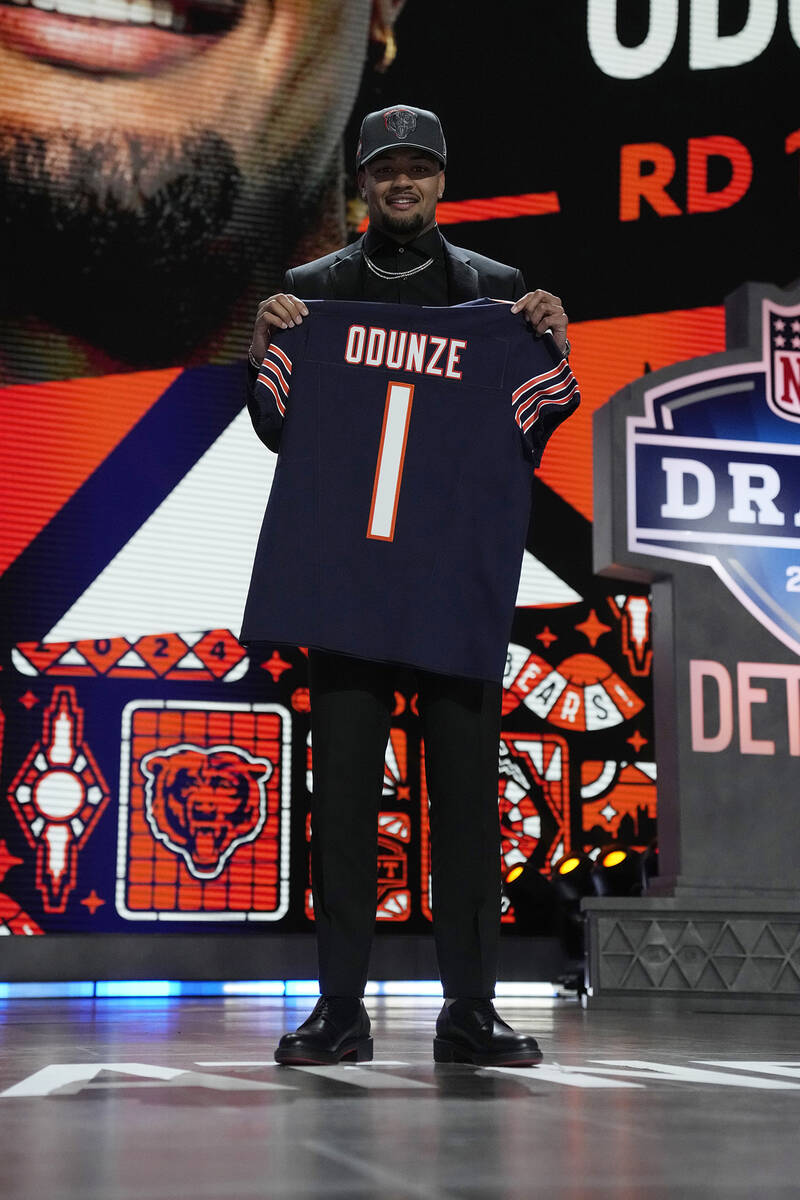 Washington wide receiver Rome Odunze poses after being chosen by the Chicago Bears with the nin ...