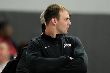 Brock Bowers watches from the sidelines during Georgia's Pro Day, Wednesday, March 13, 2024, in ...