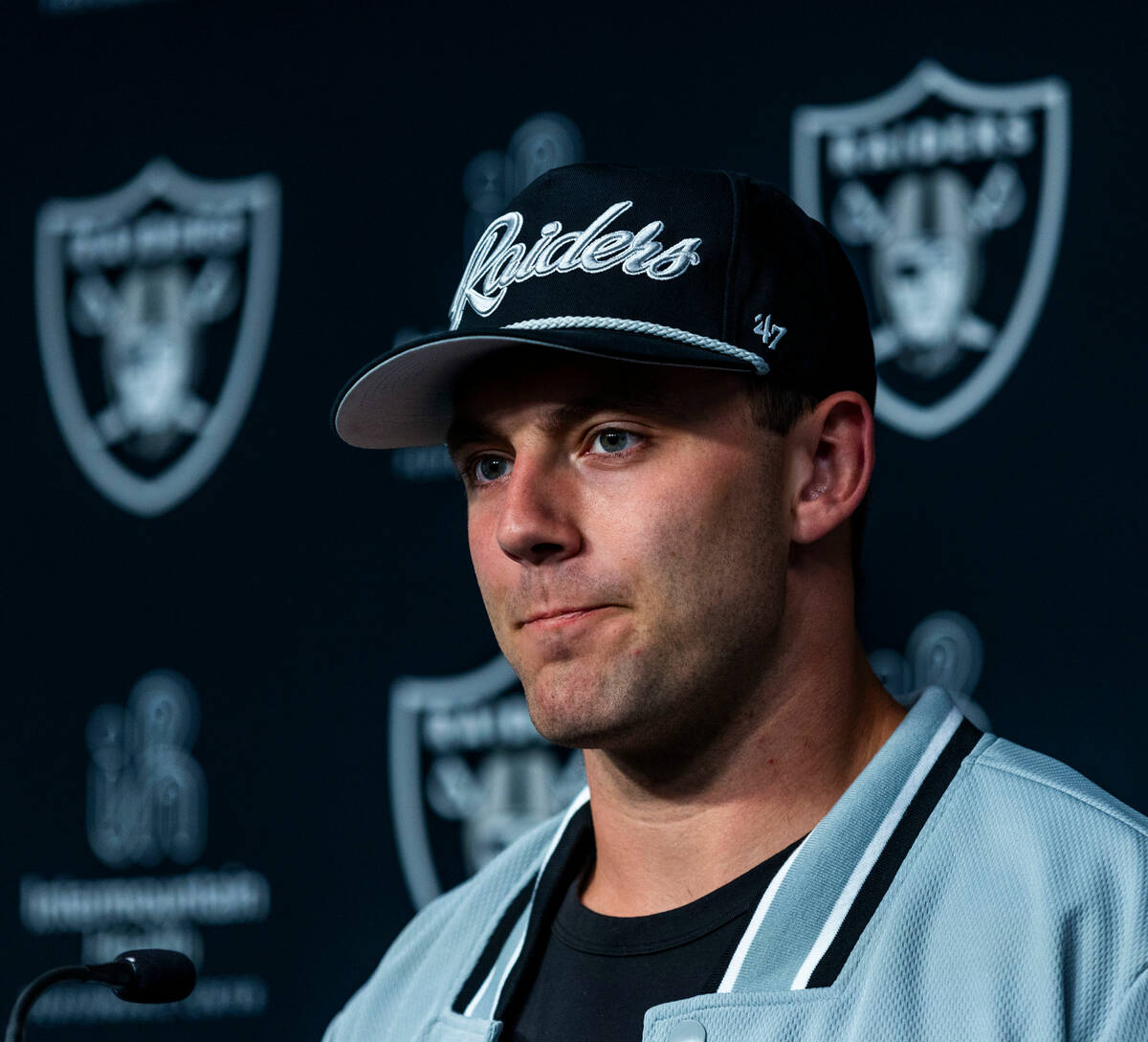 Raiders first round draft pick Brock Bowers considers a question as he speaks during a press co ...