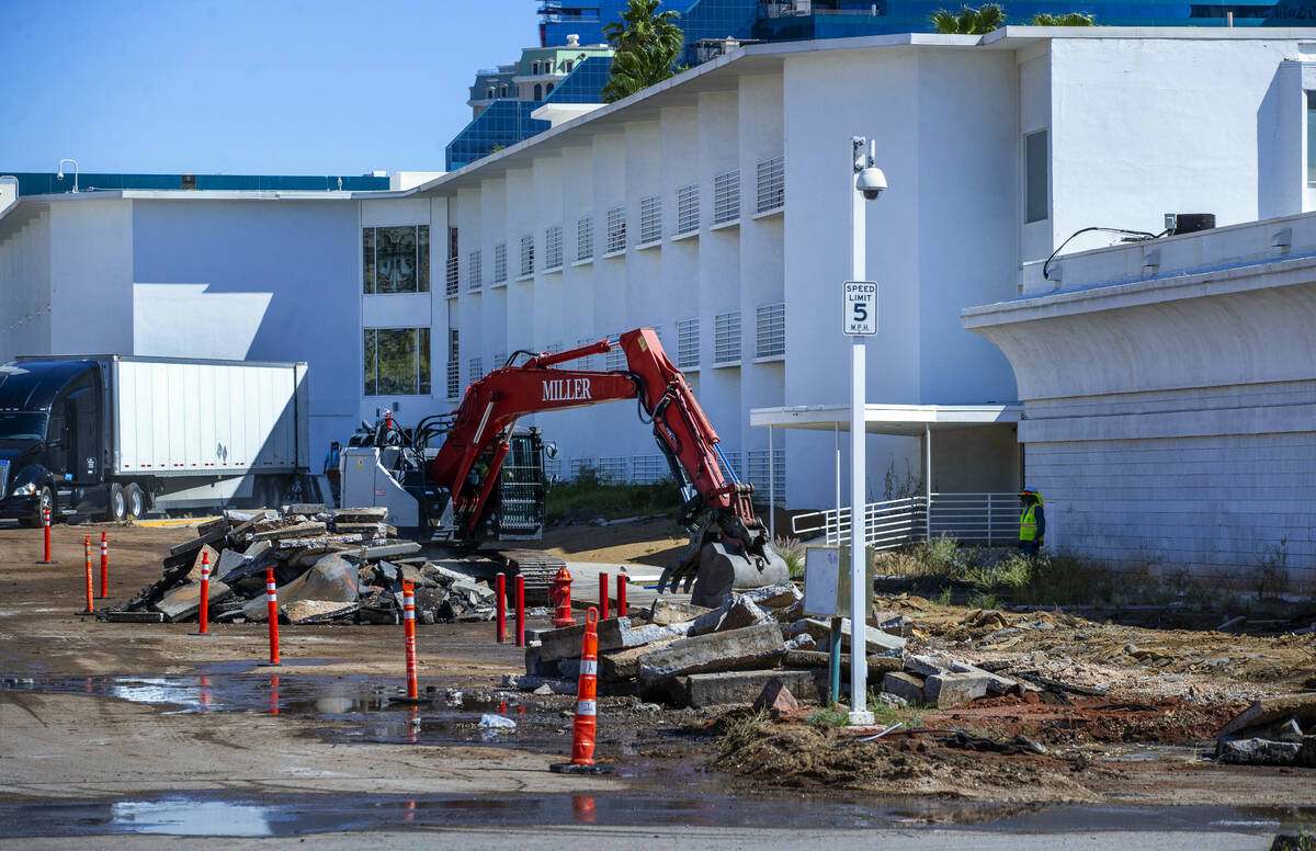 Demolition work continues on the Tropicana hotel-casino as a crew removes concrete and pavement ...