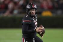 South Carolina quarterback Spencer Rattler (7) runs for a first down during the first half of a ...