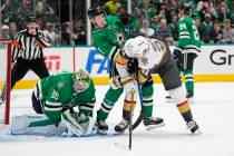 Dallas Stars goaltender Jake Oettinger (29) collects the puck as teammate Nils Lundkvist (5) de ...